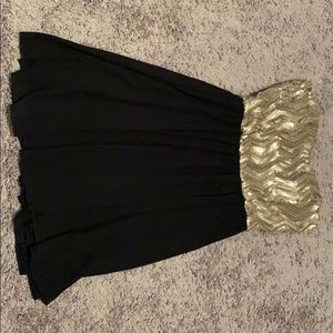 Gold and black sequin dress.